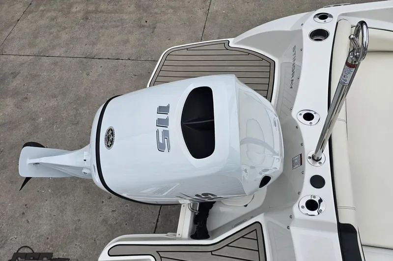 Slide: The Image of 2022 Stingray 182 SC boat with powerful outboard motor, sleek design, and modern features. - 32