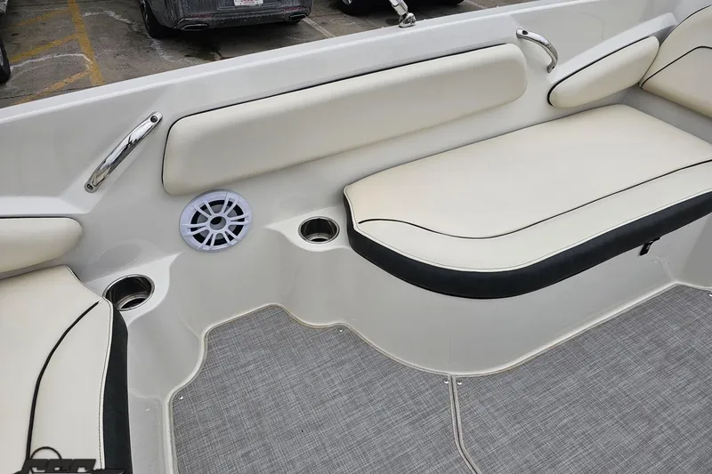Slide: The Image of 2022 Stingray 182 SC boat interior with cushioned seating and speaker. - 41