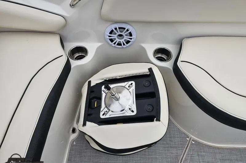 Slide: The Image of 2022 Stingray 182 SC boat interior with seating and cup holders. - 42
