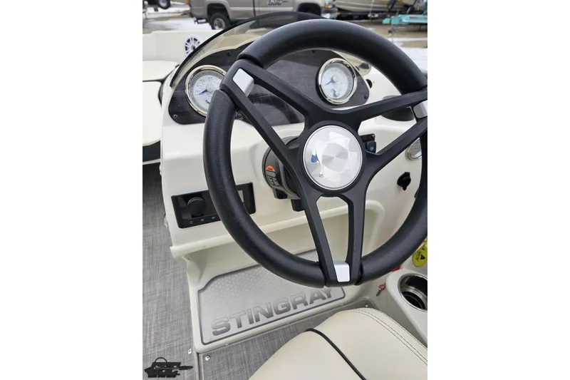 Slide: The Image of Steering wheel of 2022 Stingray 182 SC boat with dashboard and gauges. - 51