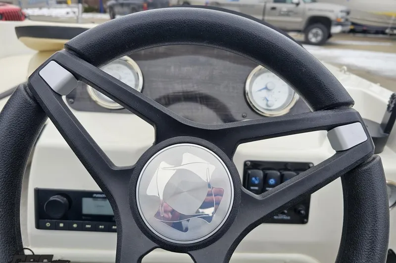 Slide: The Image of Steering wheel of 2022 Stingray 182 SC boat with dashboard instruments visible. - 55