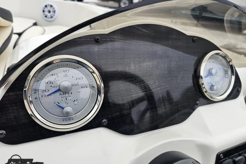 Slide: The Image of Dashboard of 2022 Stingray 182 SC boat with speedometer and fuel gauge. - 56