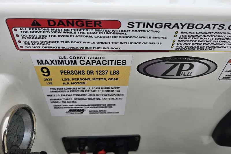 Slide: The Image of 2022 Stingray 182 SC boat safety and capacity warning labels, including U.S. Coast Guard limits. - 58