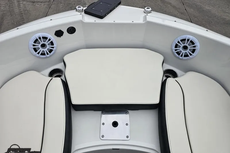 Slide: The Image of 2022 Stingray 182 SC boat interior with cushioned seating and speakers. - 70