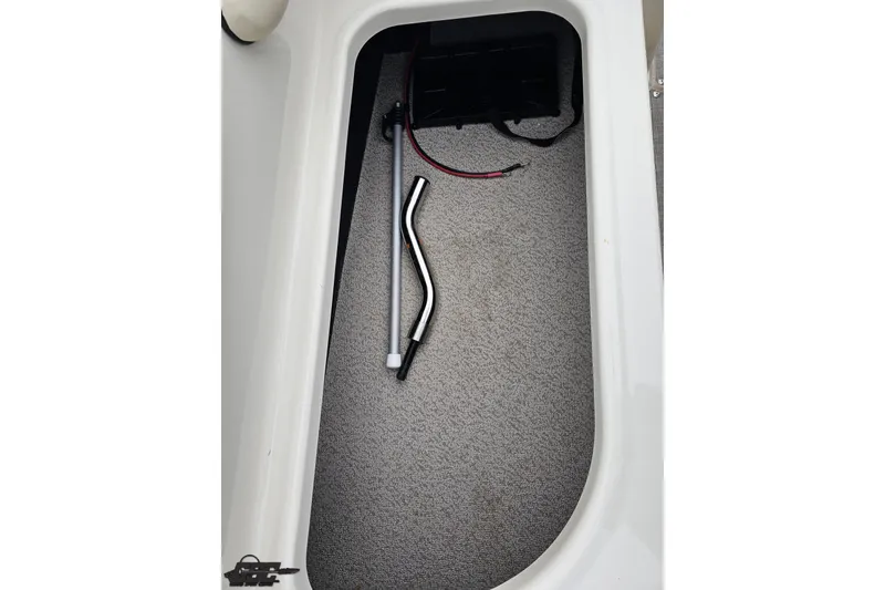 Slide: The Image of Storage compartment in 2022 Stingray 182 SC boat with tools and wiring. - 79