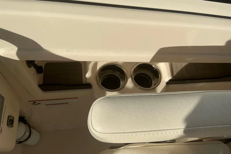 Slide: The Image of 2020 Grady-White Freedom 275 boat interior with cup holders and seating. - 21