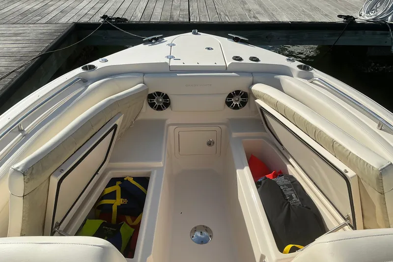 Slide: The Image of 2020 Grady-White Freedom 275 boat interior with seating and storage compartments. - 27