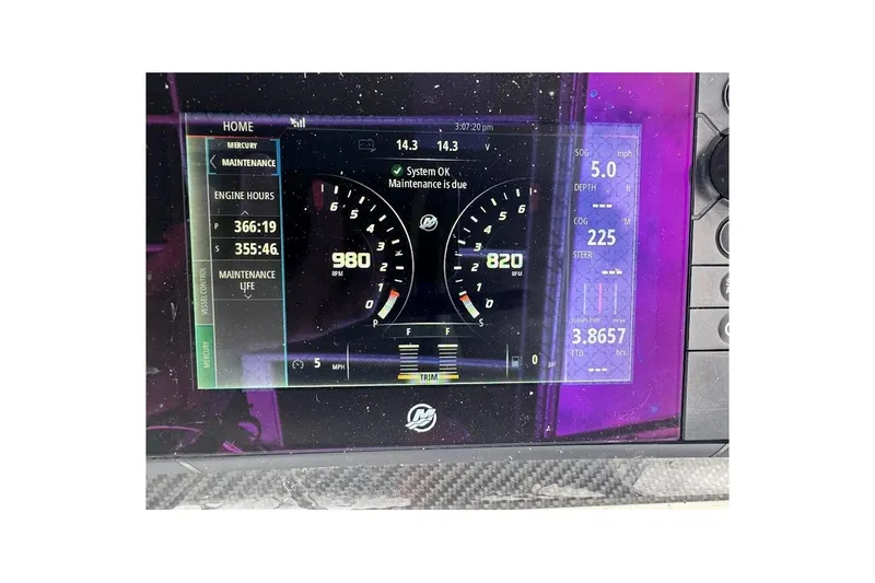 Slide: The Image of Dashboard display of a 2001 Contender 35 Side Console boat showing engine data. - 26