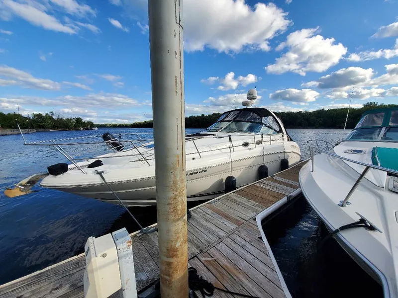 The Image of 2004 Sea Ray 360 Sundancer docked on a sunny day. - 0