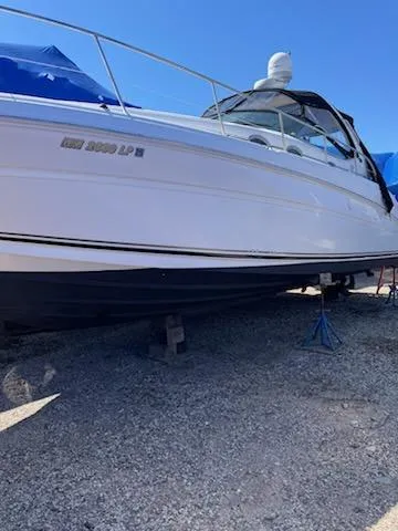 Slide: The Image of 2004 Sea Ray 360 Sundancer yacht on gravel. - 10