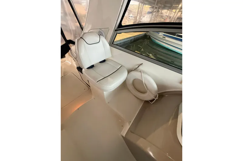 Slide: The Image of 1998 Bayliner 3685 Avanti Sunbridge interior with white seating and life preserver. - 15
