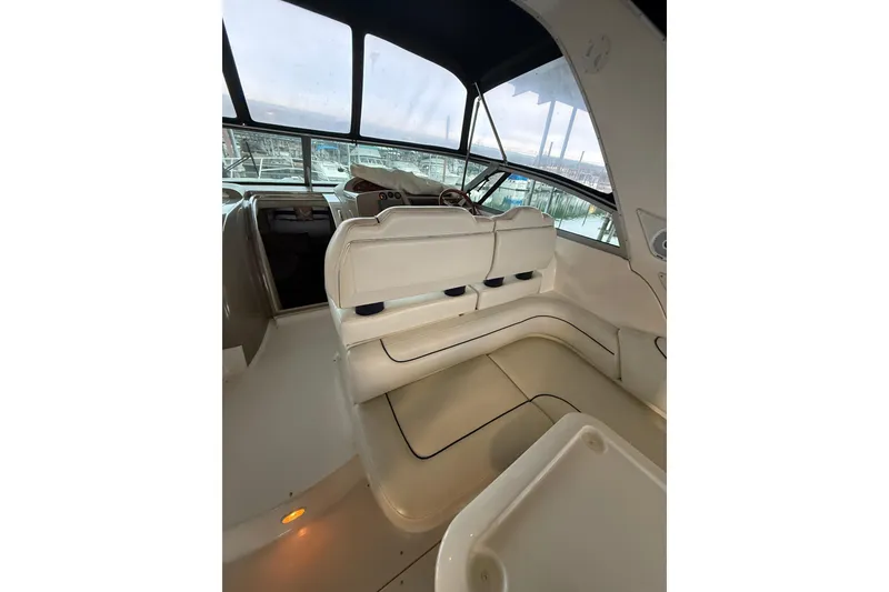 Slide: The Image of 1998 Bayliner 3685 Avanti Sunbridge interior with helm and seating area. - 18