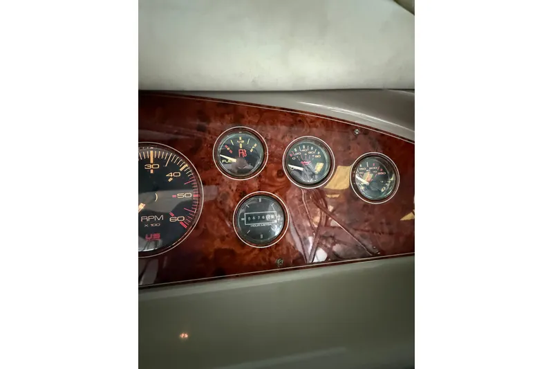 Slide: The Image of Dashboard of 1998 Bayliner 3685 Avanti Sunbridge with RPM and fuel gauges. - 20