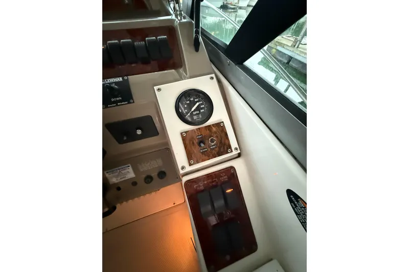 Slide: The Image of 1998 Bayliner 3685 Avanti Sunbridge dashboard with gauges and controls. - 24