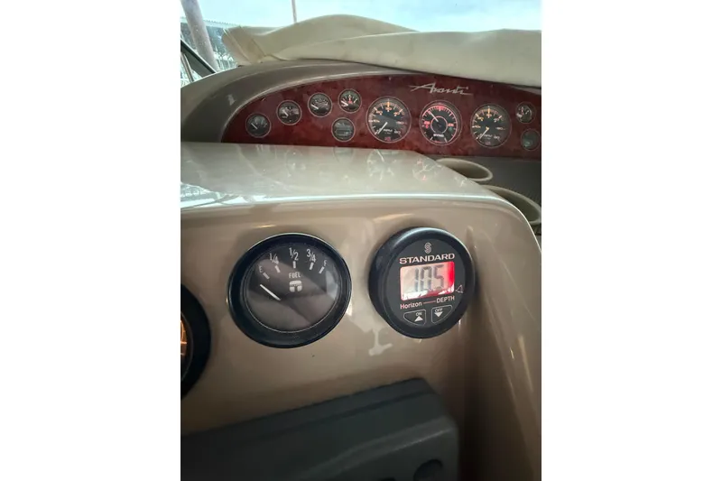 Slide: The Image of Dashboard of 1998 Bayliner 3685 Avanti Sunbridge with gauges and depth meter. - 37