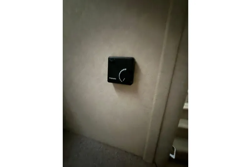 Slide: The Image of Thermostat on 1998 Bayliner 3685 Avanti Sunbridge boat interior wall. - 38