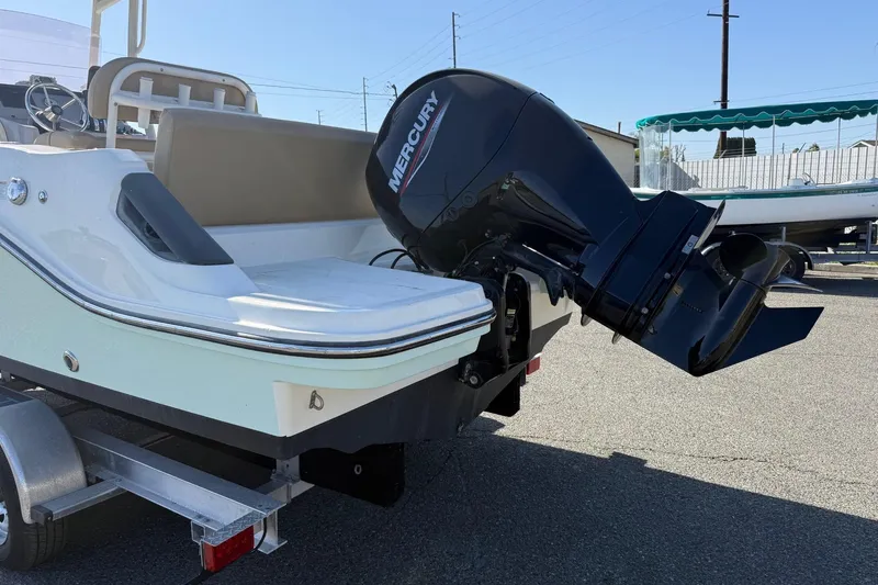 Slide: The Image of 2022 2 Bar T22 CX boat with Mercury outboard motor on trailer. - 20