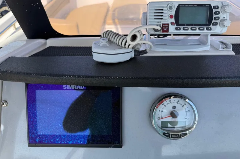 Slide: The Image of Dashboard of 2022 2 Bar T22 CX boat with radio and Simrad display. - 9