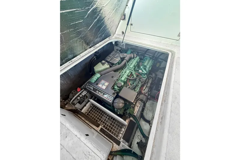 Slide: The Image of Engine compartment of a 2003 SeaSport Pacific 3200 boat, featuring a KAD 300 engine. - 34