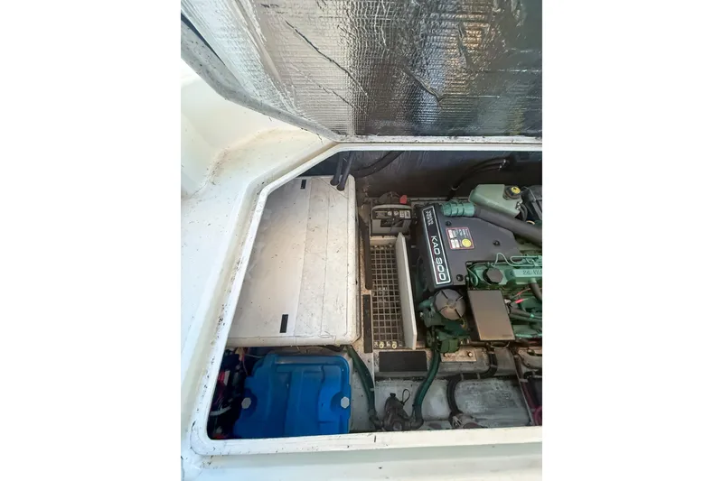 Slide: The Image of Engine compartment of a 2003 SeaSport Pacific 3200 boat, featuring a Volvo Penta KAD 300 engine. - 35
