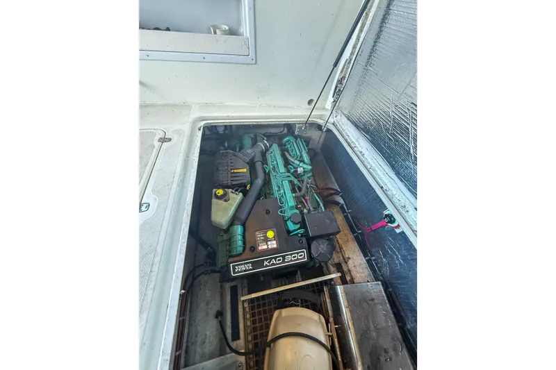 Slide: The Image of Engine compartment of a 2003 SeaSport Pacific 3200 boat with Volvo Penta KAD 300 engine. - 36