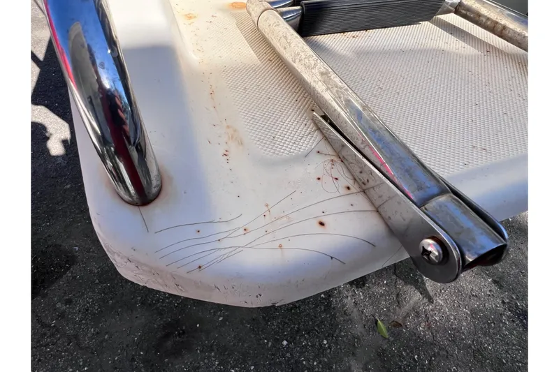 Slide: The Image of Scratched surface of 2008 Scout 205 Dorado boat with metal fittings. - 11