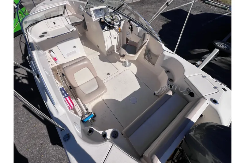 Slide: The Image of 2008 Scout 205 Dorado boat interior with seating and steering console. - 15