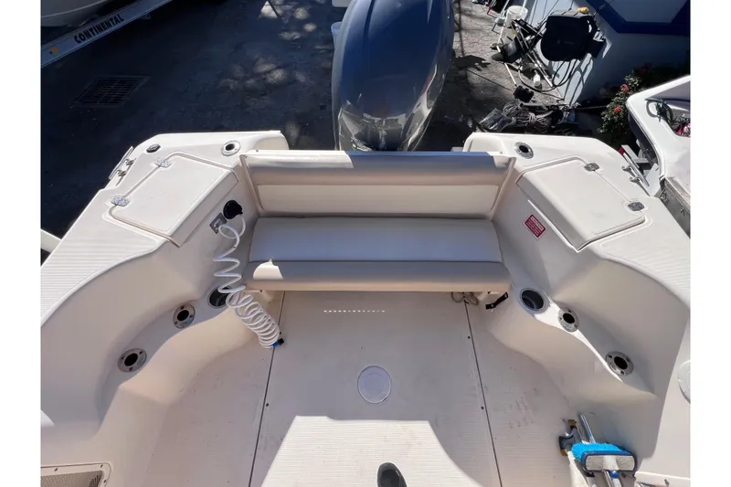 Slide: The Image of 2008 Scout 205 Dorado boat interior with seating and storage compartments. - 17