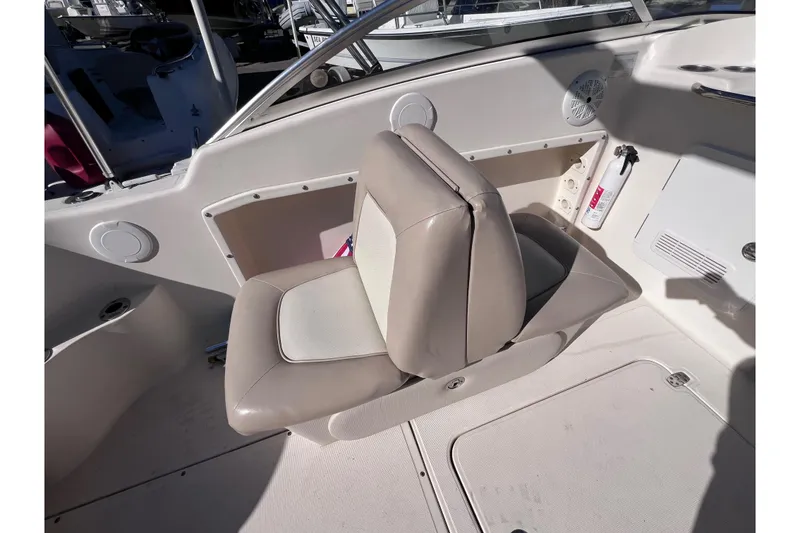 Slide: The Image of 2008 Scout 205 Dorado boat interior with beige seating and safety equipment. - 18