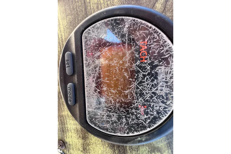 Slide: The Image of Scratched tachometer on 2008 Scout 205 Dorado boat dashboard. - 24