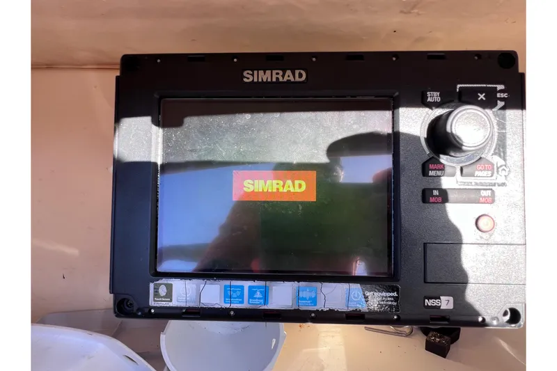 Slide: The Image of Simrad navigation system on 2008 Scout 205 Dorado boat dashboard. - 25