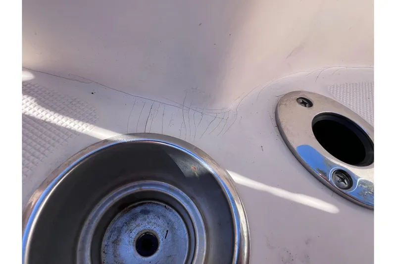 Slide: The Image of Close-up of a 2008 Scout 205 Dorado boat's metal fixtures and textured surface. - 28