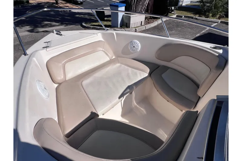 Slide: The Image of 2008 Scout 205 Dorado boat interior with beige seating and built-in speakers. - 29