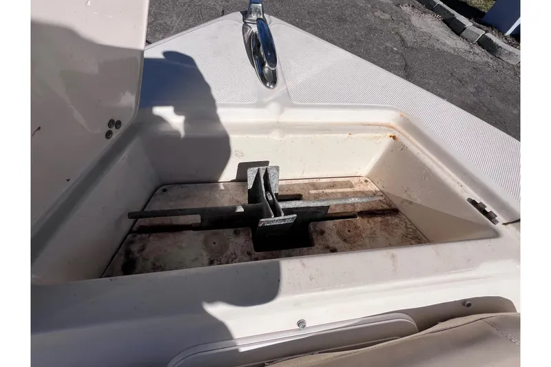 Slide: The Image of Anchor compartment of 2008 Scout 205 Dorado boat, showing metal anchor storage. - 33