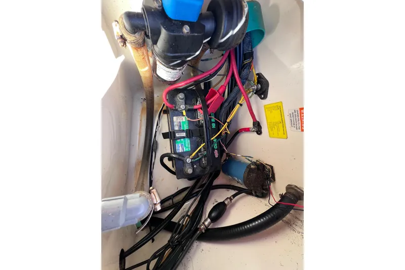 Slide: The Image of Electrical components and wiring inside a 2008 Scout 205 Dorado boat. - 36