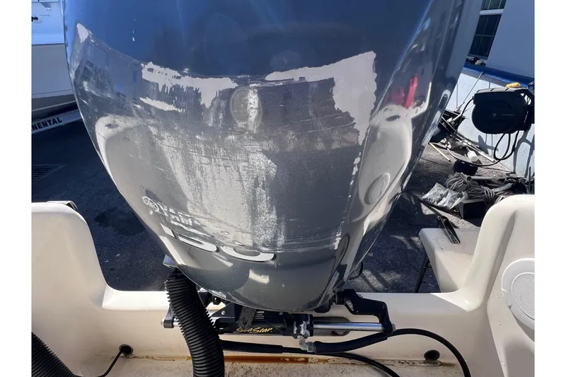 Slide: The Image of 2008 Scout 205 Dorado boat engine with visible wear and tear. - 6