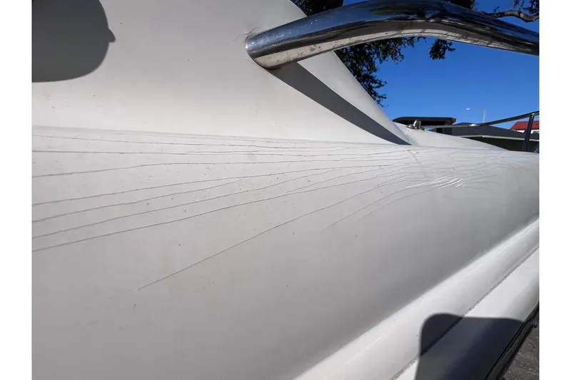 Slide: The Image of Close-up of 2008 Scout 205 Dorado boat hull with visible surface cracks. - 8