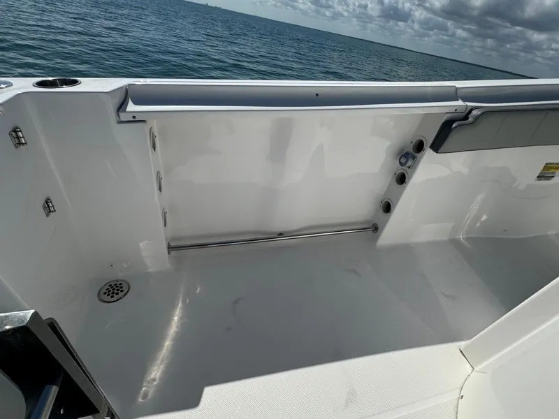Slide: The Image of 2022 Aquasport 2500 Center Console boat deck with ocean view. - 15