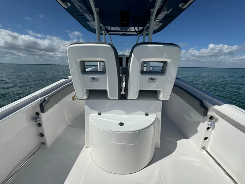 Slide: The Image of 2022 Aquasport 2500 Center Console boat interior with ocean view. - 18