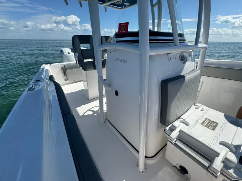 Slide: The Image of 2022 Aquasport 2500 Center Console boat on open water. - 35
