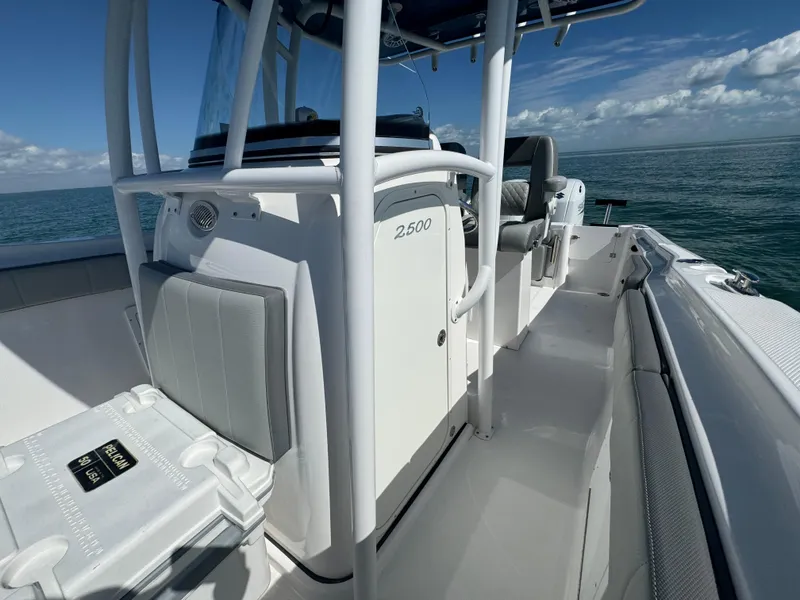 Slide: The Image of 2022 Aquasport 2500 Center Console boat on open water. - 36