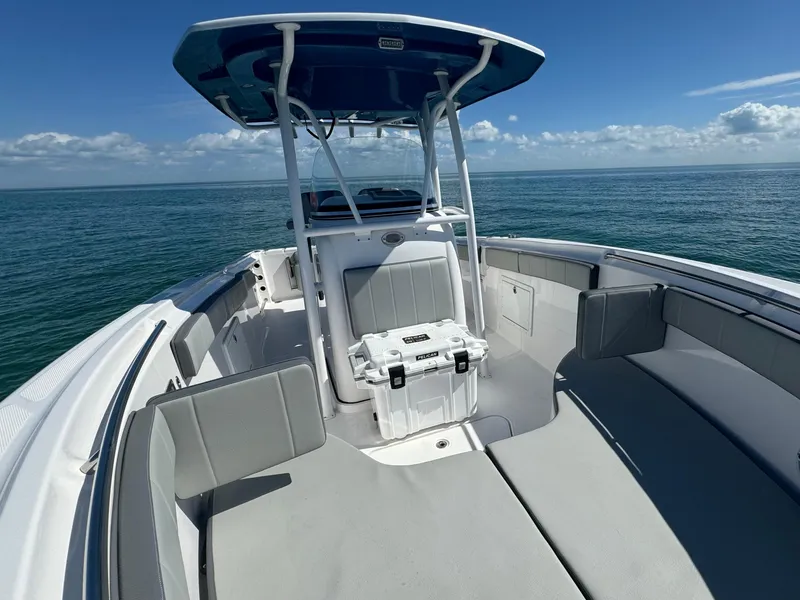 Slide: The Image of 2022 Aquasport 2500 Center Console boat on open water. - 38