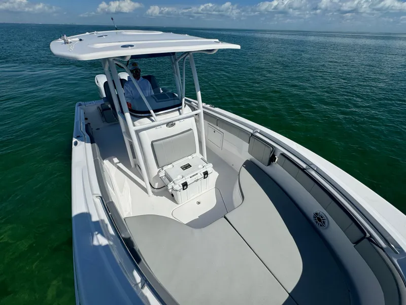 Slide: The Image of 2022 Aquasport 2500 Center Console boat on calm ocean waters. - 43