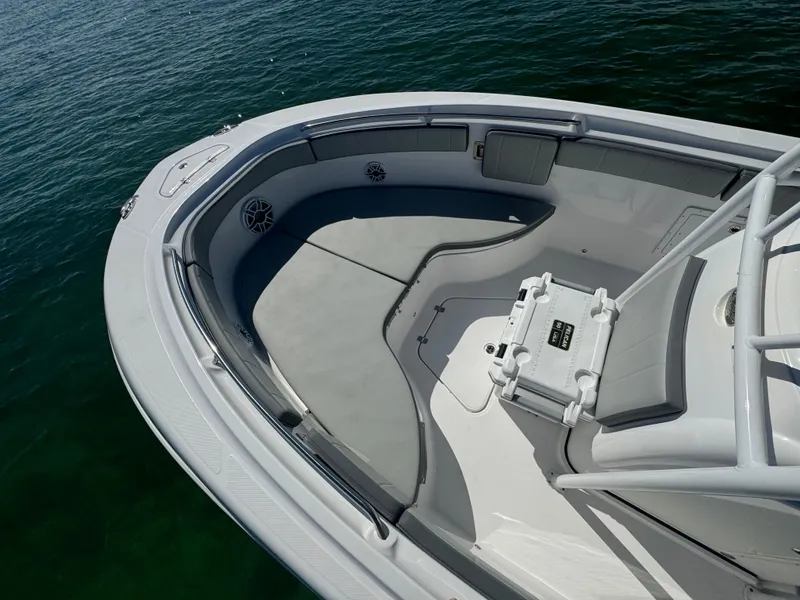 Slide: The Image of 2022 Aquasport 2500 Center Console boat interior with cushioned seating. - 46