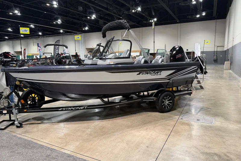 The Image of 2026 Starcraft Titan 186 boat displayed indoors on a trailer. - 1