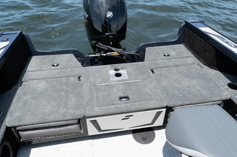 Slide: The Image of 2026 Starcraft Titan 186 boat interior with Mercury outboard motor on water. - 3