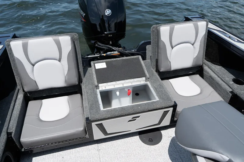 Slide: The Image of 2026 Starcraft Titan 186 boat interior with gray seating and storage compartment. - 4