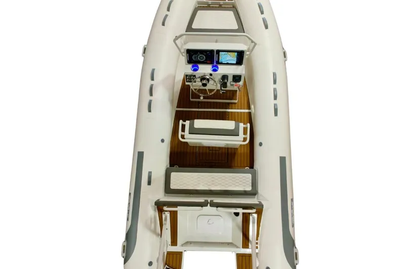 Slide: The Image of 2026 Tide Craft Sanibel 17 boat, top view, featuring modern dashboard and seating. - 1
