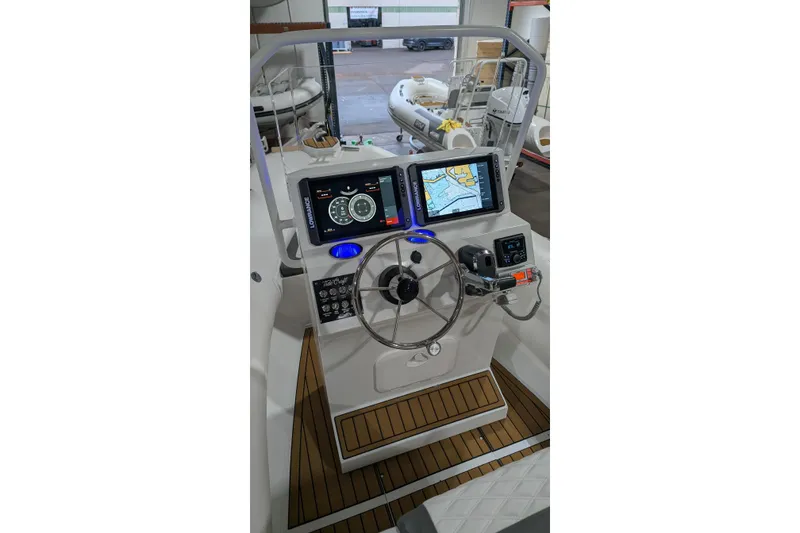 Slide: The Image of 2026 Tide Craft Sanibel 17 boat dashboard with modern navigation and control systems. - 2