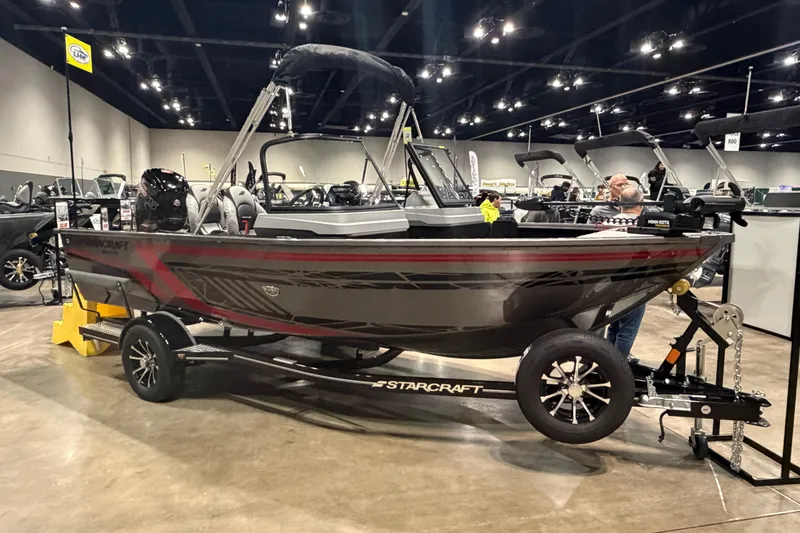 The Image of 2026 Starcraft Delta 178 DC Pro boat displayed indoors on a trailer. - 0
